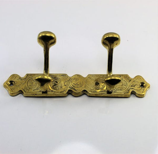 Coat hook for wall or door made of unlacquered brass