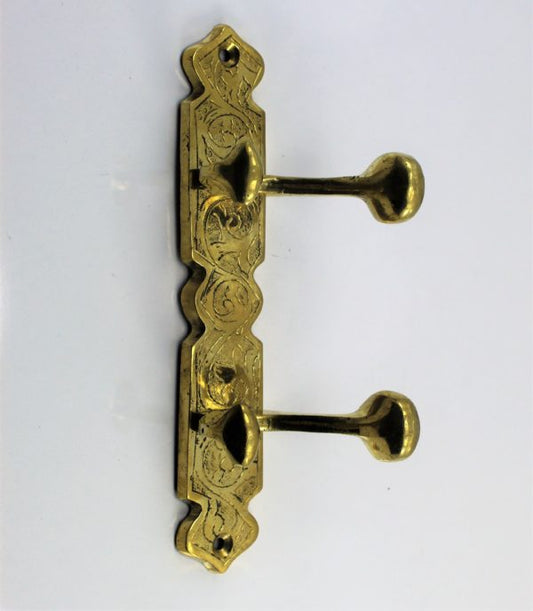 Coat hook for wall or door made of unlacquered brass